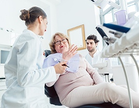 Dental implant consultation between female patient and dentist