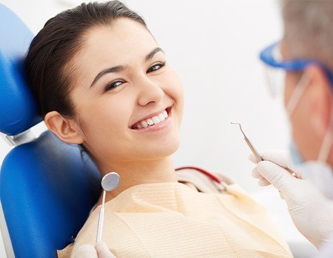 Woman smiling during dental checkup