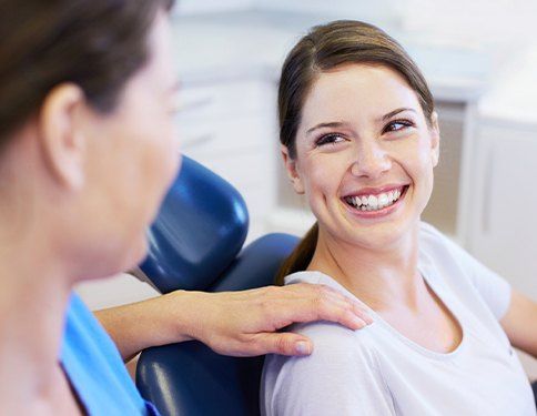 Woman smiling at dentist