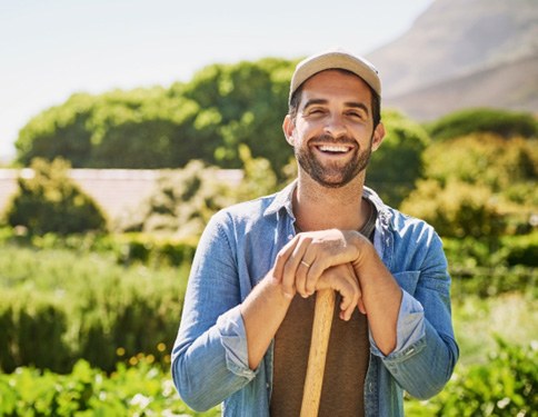 smiling person gardening