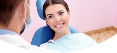 Smiling woman in dental chair during dental checkup