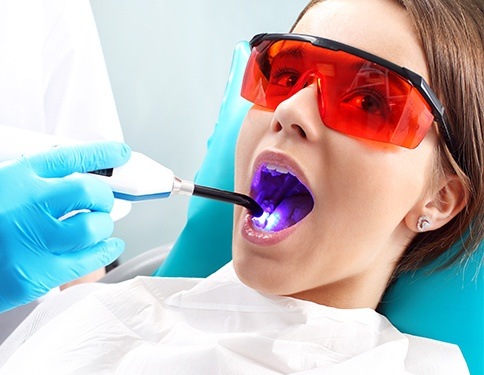 Patient receiving dental sealants