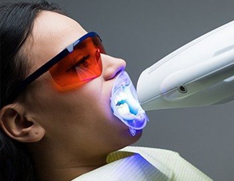 Patient receiving zoom teeth whitening teatment