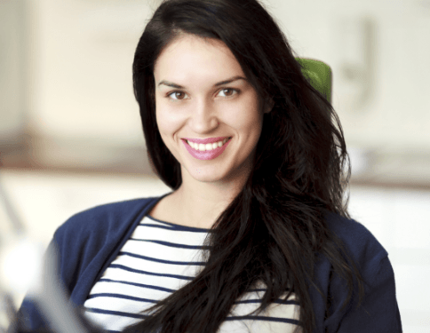 Smiling woman during emergency dentistry appointment