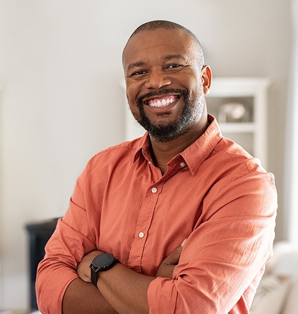 Man sharing healthy smile after tooth extraction