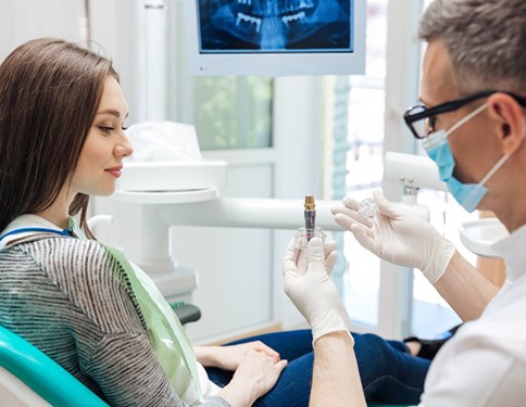 Patient in Tyler talking to dentist about dental implants