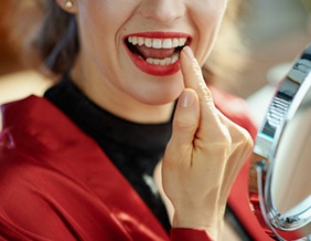Patient in Tyler brushing their dental implants