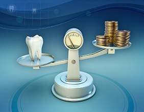 Tooth and coins on balance scale