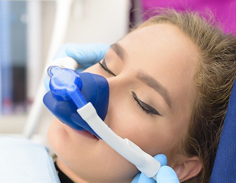 Woman with nitrous oxide dental sedation mask