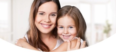 Mother and daughter smiling after children's dentistry appointment