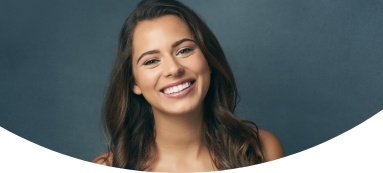 Woman with flawless smile after cosmetic dentistry