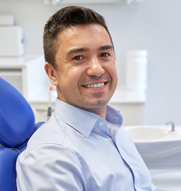 Man in dental chair smiling